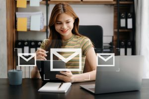 woman hands using laptop tablet typing keyboard surfing internet with email icon email marketing concept send email newsletter online working internet network technologyxa