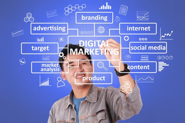 asian businessman smiling writing digital marketing graphic words virtual screen