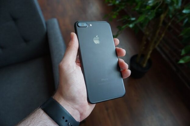 Hand holding a smartphone, the device Core Web Vitals field data comes from