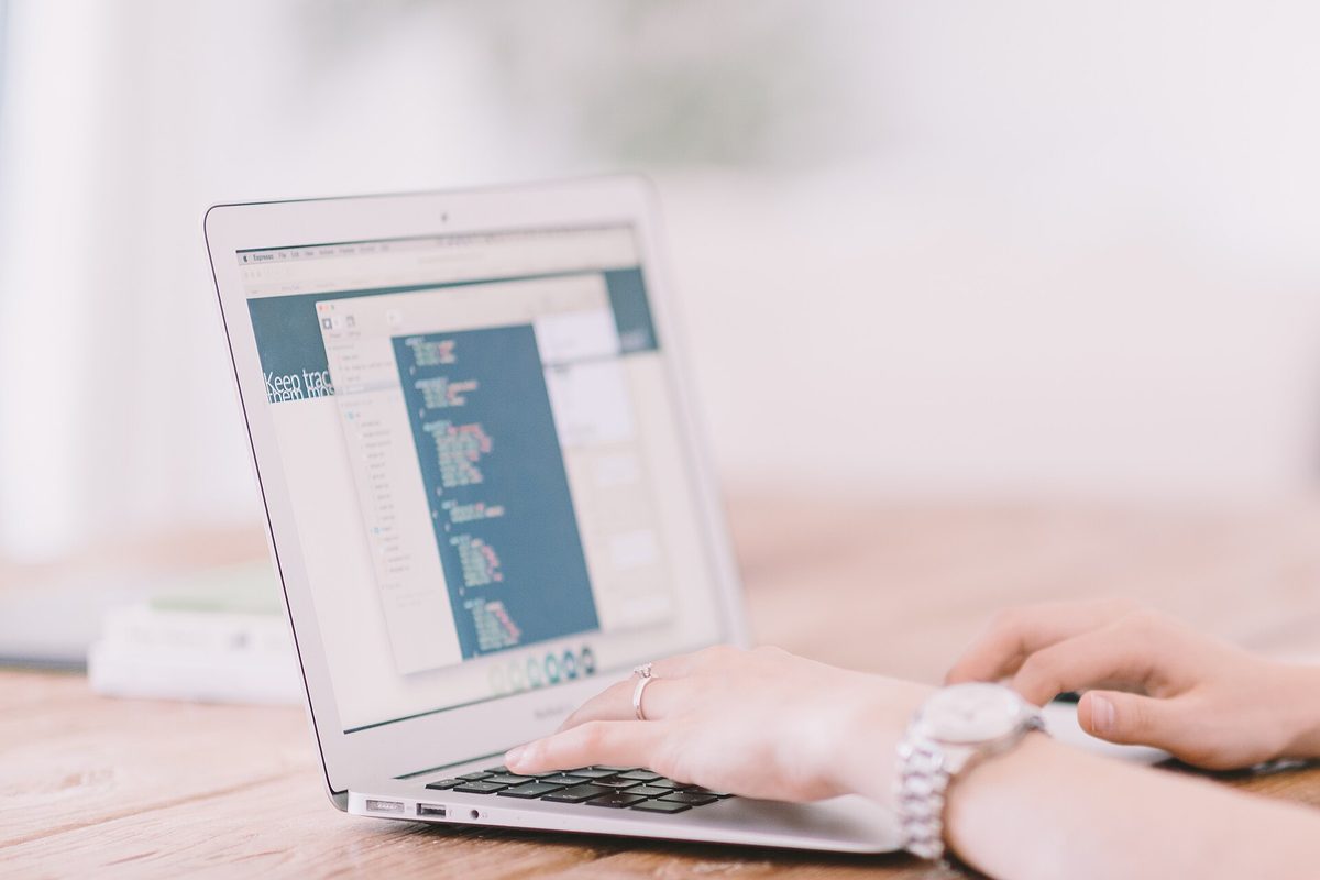 Programmer writing code for a custom web application